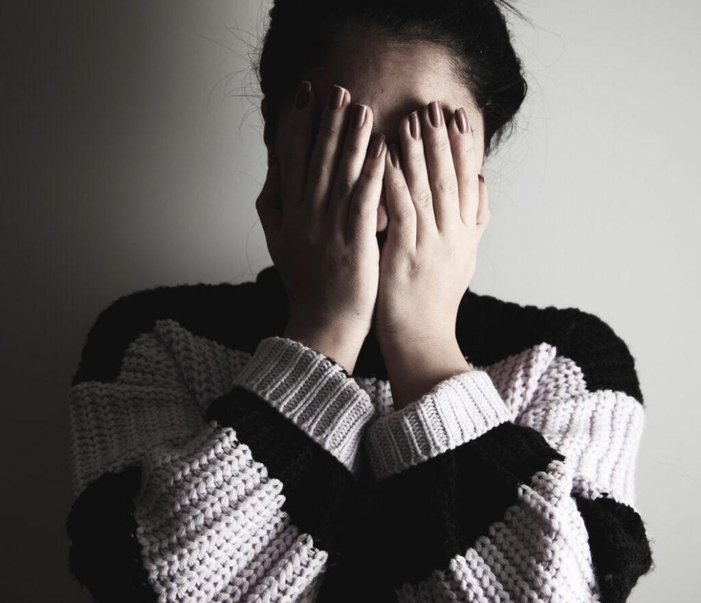 sad woman hand in face